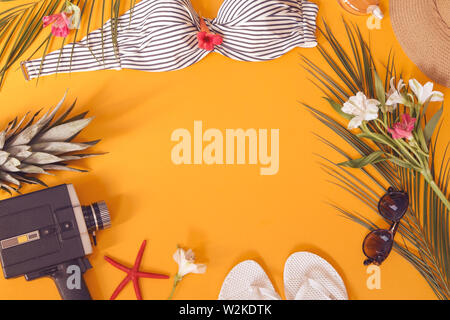 Summer woman`s accessories on yellow background Stock Photo
